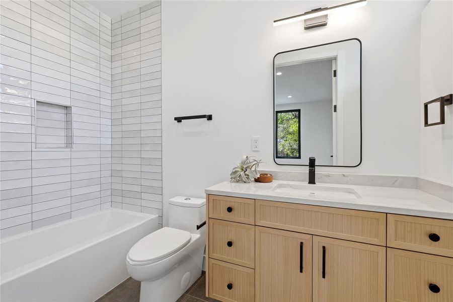 Bathroom featuring vanity and tub / shower combination