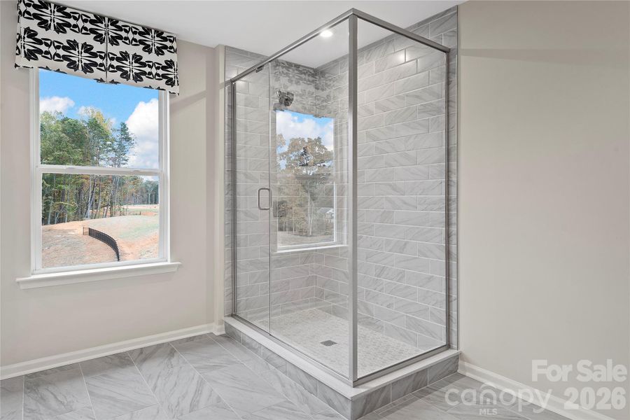 Semi-Frameless walk-in shower.
