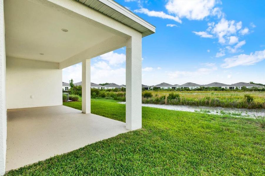 Exterior details and patio area of a home in Woodcreek, Wesley Chapel (Image 4).