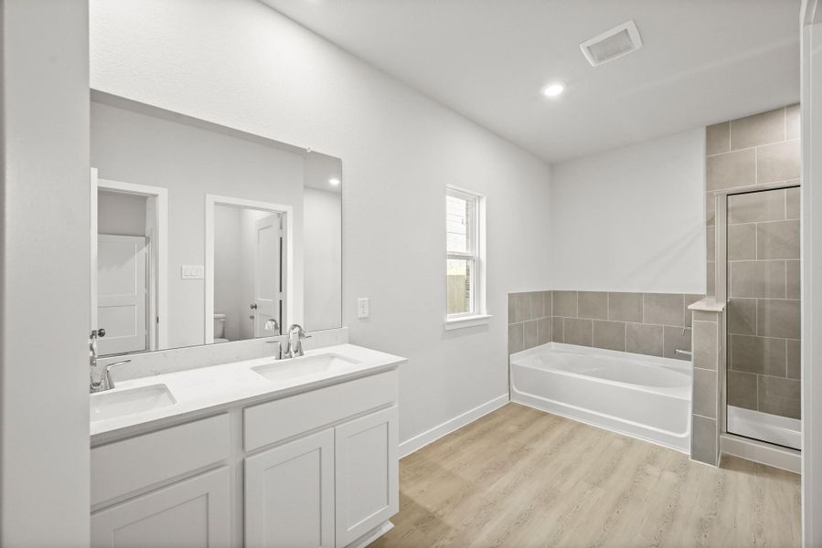 Furnished interior view inside a new home in Sunterra, Katy (Image 6).