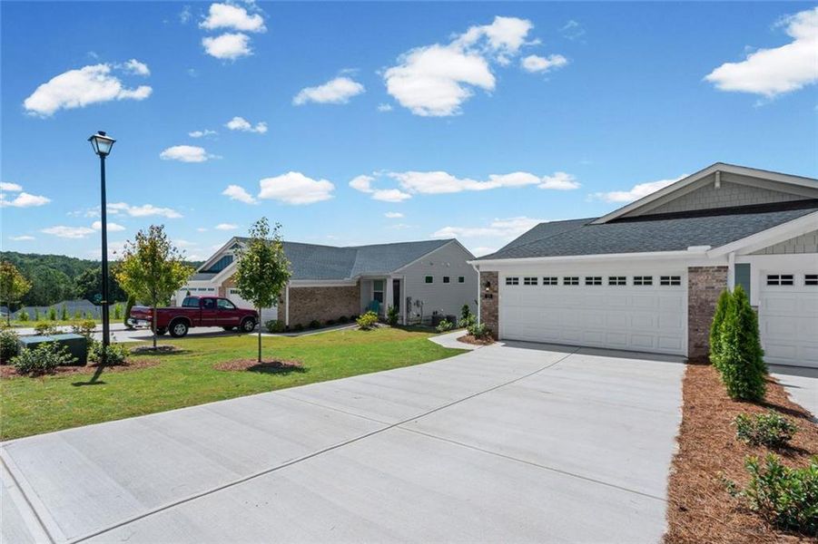 Front exterior of a new home in Villas at Gold Creek, Dawsonville, GA, highlighting curb appeal (Image 18).