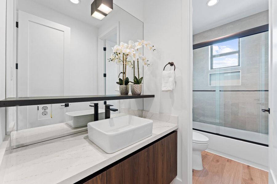 A deep soaking tub, built-in niche shelving, and designer tilework create everyday luxury upstairs. A deep soaking tub, built-in niche shelving, and designer tilework create everyday luxury upstairs.