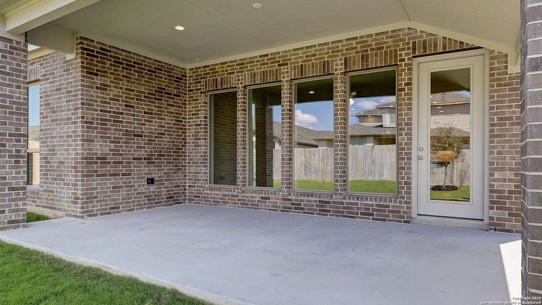 Exterior details and patio area of a home in Kallison Ranch 50', San Antonio (Image 29).