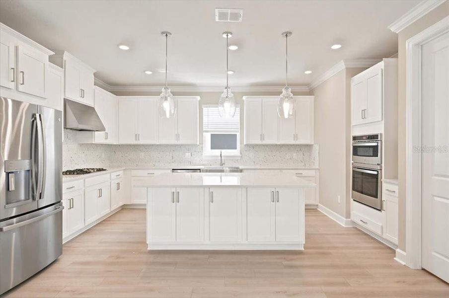 Furnished interior view inside a new home in Coasterra Community Group Page, Palmetto (Image 5).