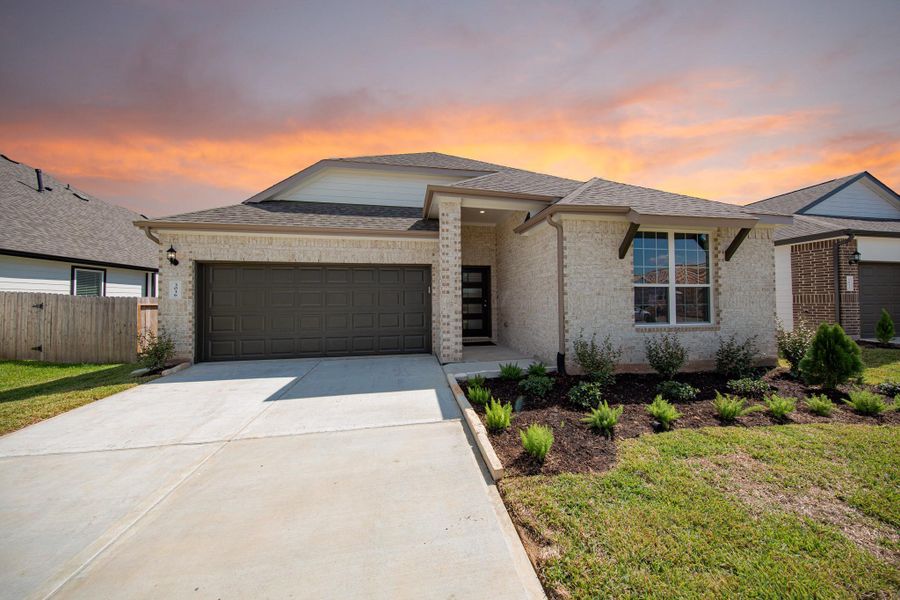 Front exterior of a new home in Bluestem, Brookshire, TX, highlighting curb appeal (Image 2).