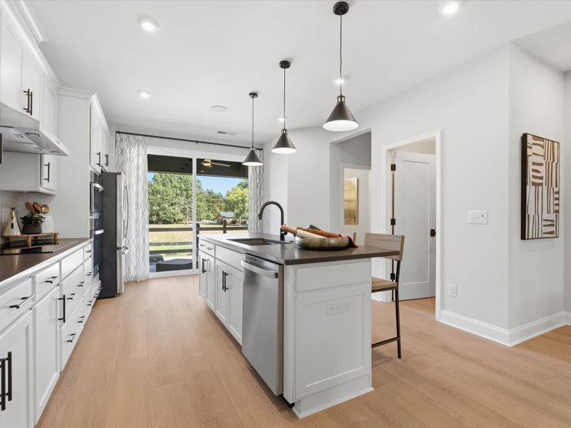 Representative furnished interior of a home built from the Dahlia by Tri Pointe Homes in Bellflower, Charlotte (Image 14).