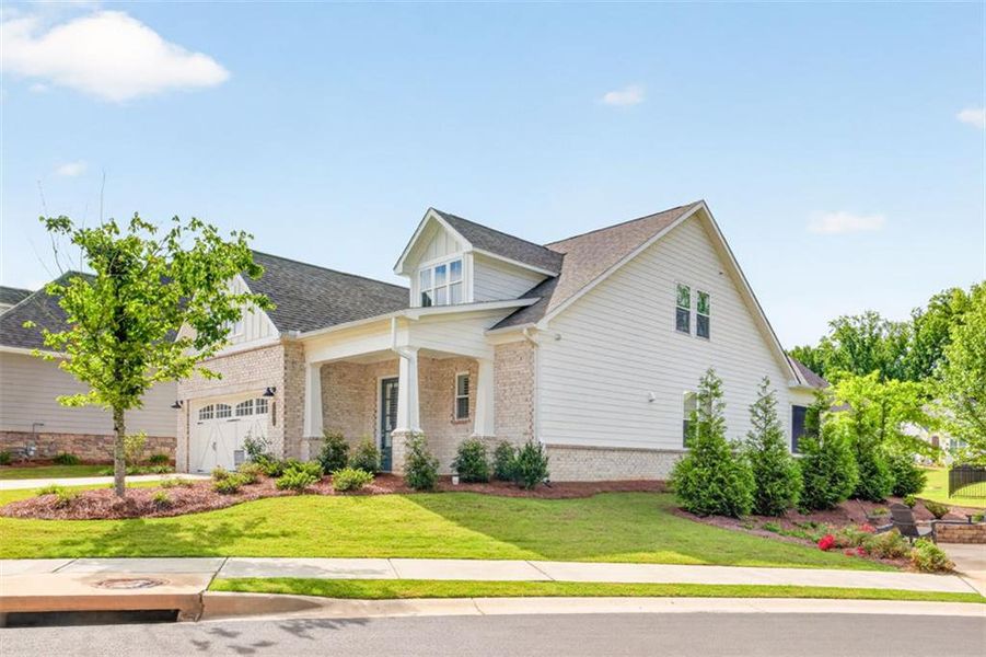 Front exterior of a new home in , Cumming, GA, highlighting curb appeal (Image 2). Front exterior of a new home in , Cumming, GA, highlighting curb appeal (Image 2).