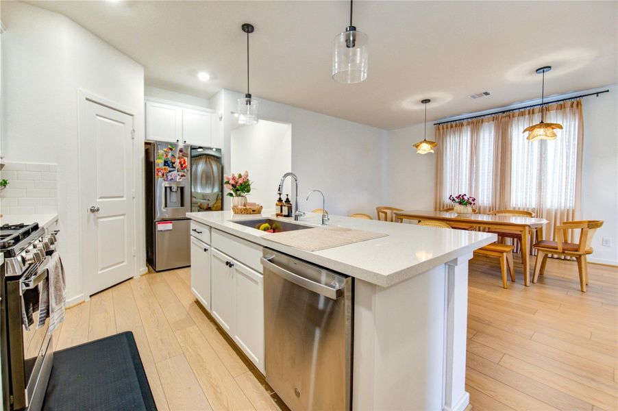 The Gourmet kitchen offers abundance of light and a free-flowing layout workspace great for your meal preparations. Offers a walk in pantry with shelving plus lots of cabinet space that you'll never run out of room to store your culinary tools and materials.
