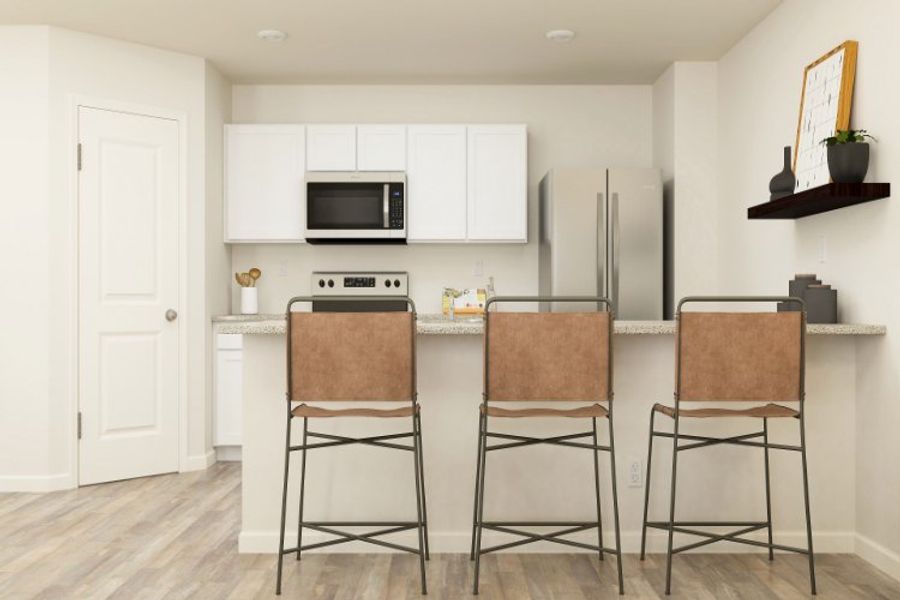 A kitchen with white cabinets. A kitchen with white cabinets.