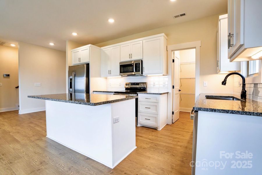 Furnished interior view inside a new home in , Lenoir (Image 4).