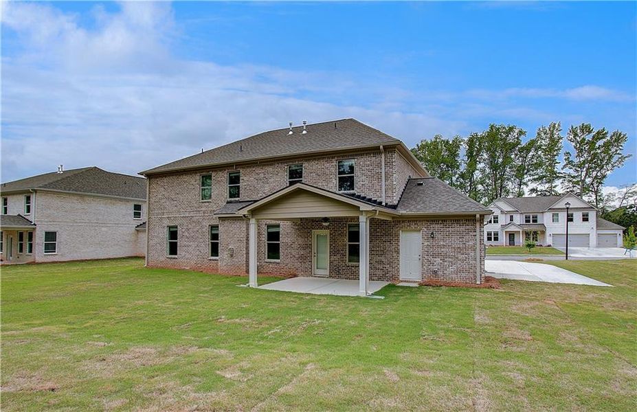 Exterior details and patio area of a home in Cambria at Traditions, Hampton (Image 4).