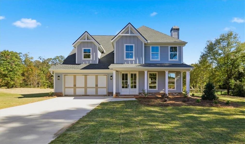 Front exterior of a new home in , Statham, GA, highlighting curb appeal (Image 1).