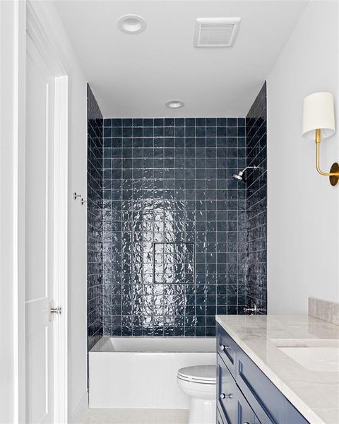 Full bathroom featuring shower / bathtub combination, vanity, recessed lighting, and tile patterned floors