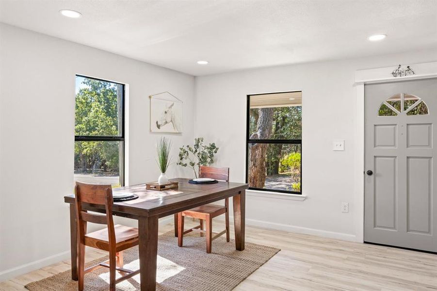 Dining room featuring a wealth of natural light and light hardwood / wood-style floors