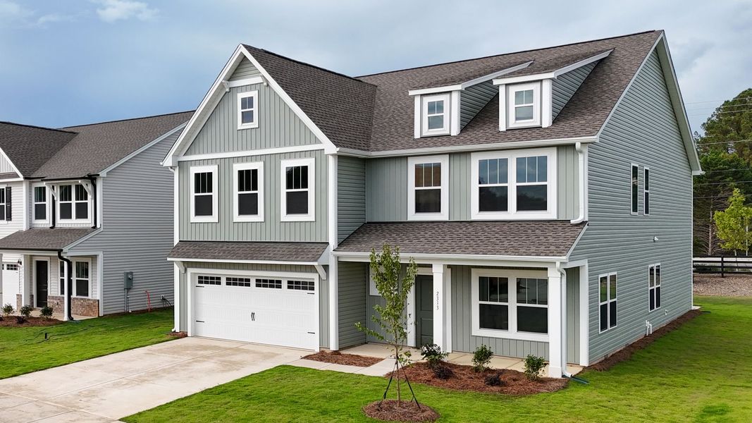 Front exterior of a new home in Morrow Brook, Albemarle, NC, highlighting curb appeal (Image 1). Front exterior of a new home in Morrow Brook, Albemarle, NC, highlighting curb appeal (Image 1).