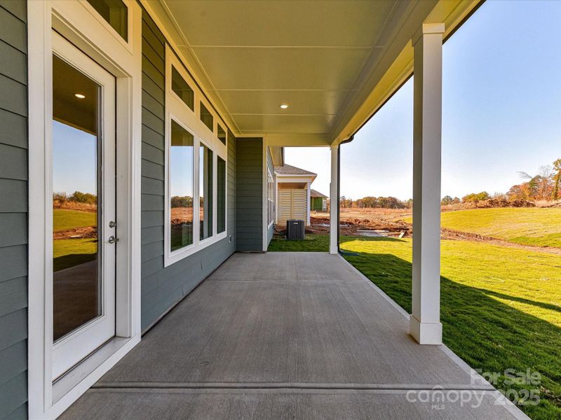 Exterior details and patio area of a home in Encore at Streamside - Tradition Series, Waxhaw (Image 31).