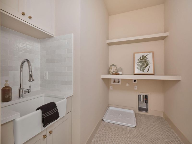 Laundry room with hookup for an electric dryer, gas dryer hookup, hookup for a washing machine, carpet, and cabinet space Laundry room with hookup for an electric dryer, gas dryer hookup, hookup for a washing machine, carpet, and cabinet space
