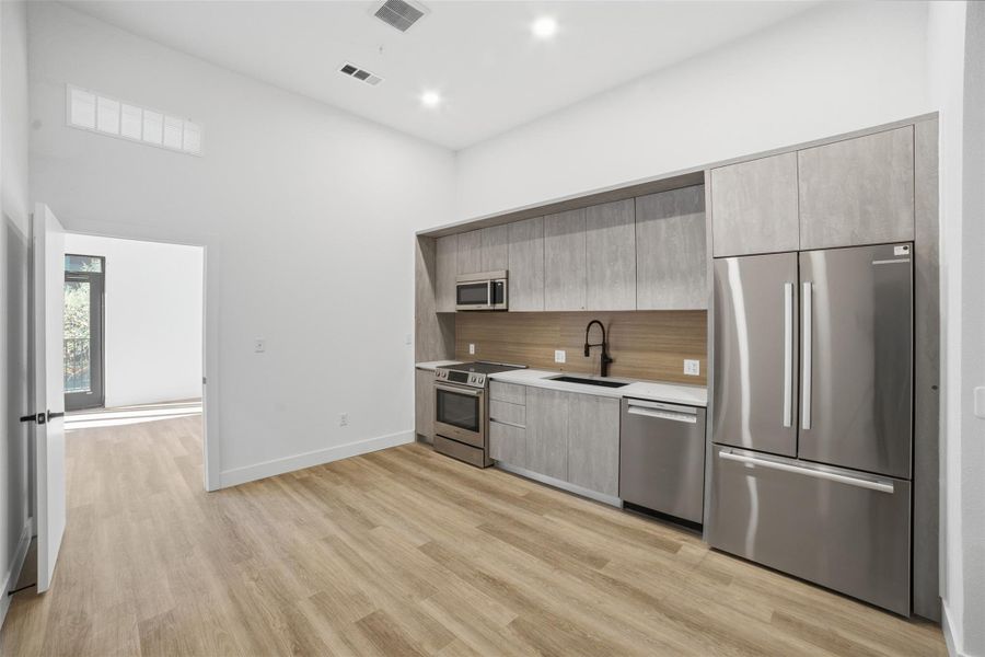 Furnished interior view inside a new home in Congress Lofts Saint Elmo, Austin (Image 3).