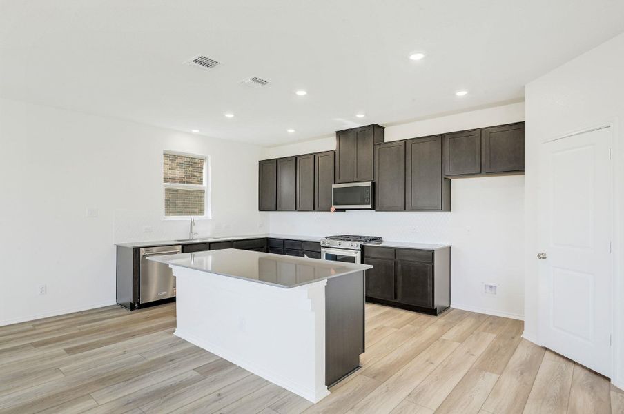 Furnished interior view inside a new home in Salerno - Classic Collection, Round Rock (Image 7). Furnished interior view inside a new home in Salerno - Classic Collection, Round Rock (Image 7).
