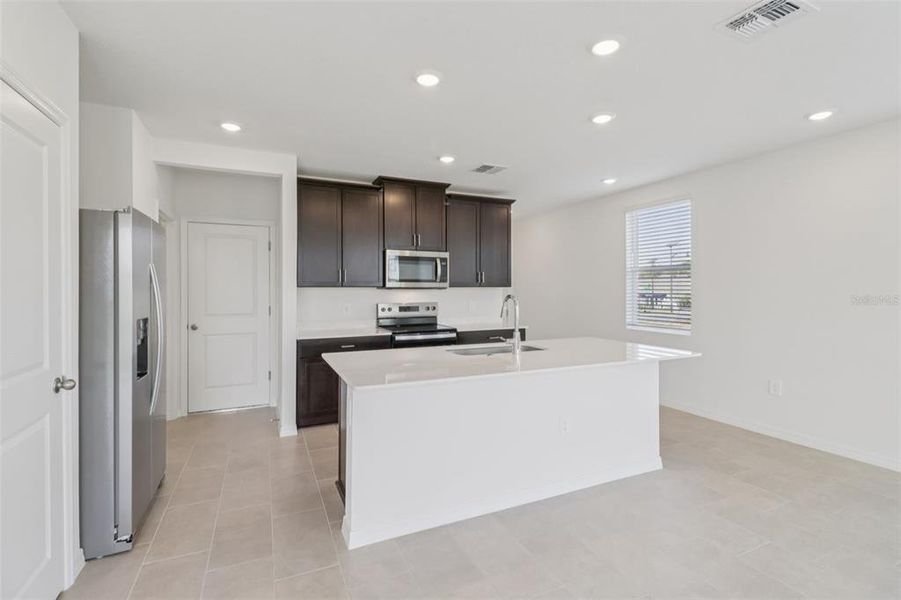 Furnished interior view inside a new home in The Reserve at Hammock Oaks Townes, Lady Lake (Image 9). Furnished interior view inside a new home in The Reserve at Hammock Oaks Townes, Lady Lake (Image 9).