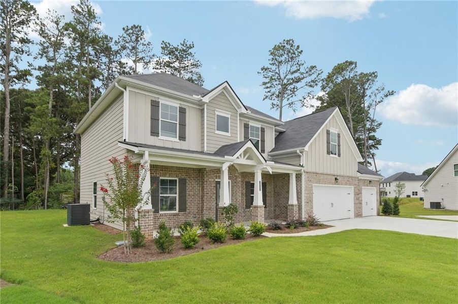 Front exterior of a new home in Stephen's Landing, Loganville, GA, highlighting curb appeal (Image 1).