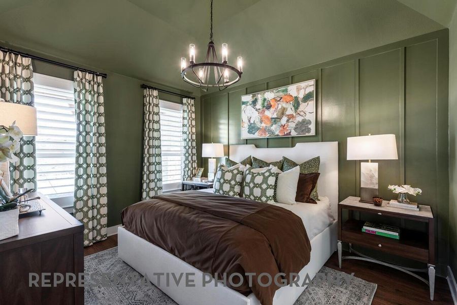 The primary bedroom feels like a serene retreat, highlighted by beautiful windows that flood the space with natural light and a sense of calm.