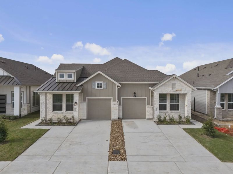 Representative exterior photo of a completed home built from the Carriagehouse by Chesmar Homes in Meridiana Townhomes, Iowa Colony, TX (Image 36).
