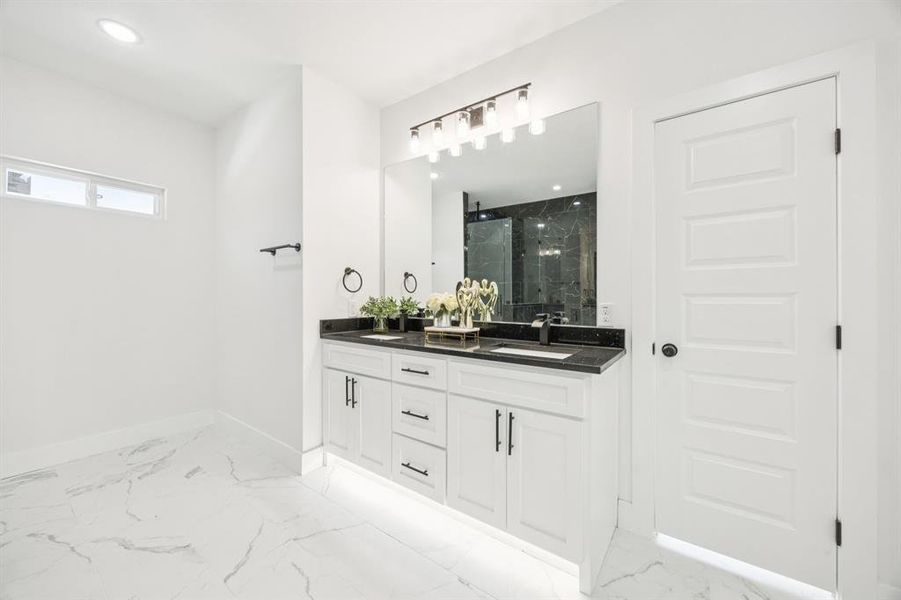 Full bathroom featuring vanity, a marble finish shower, light marble finish flooring, and recessed lighting