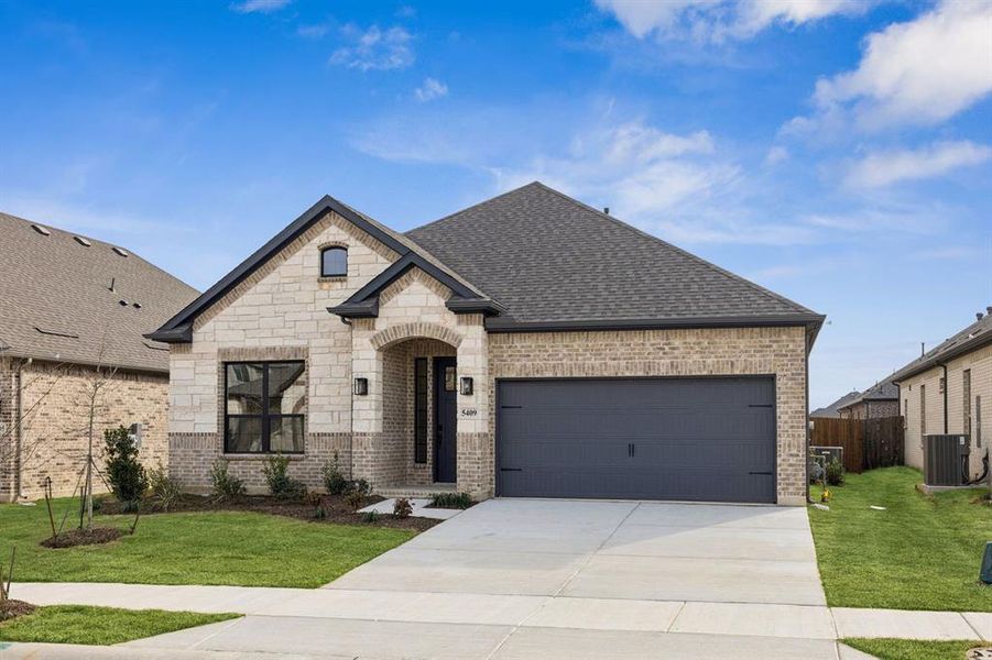 Front exterior of a new home in Country Lakes, Denton, TX, highlighting curb appeal (Image 16).