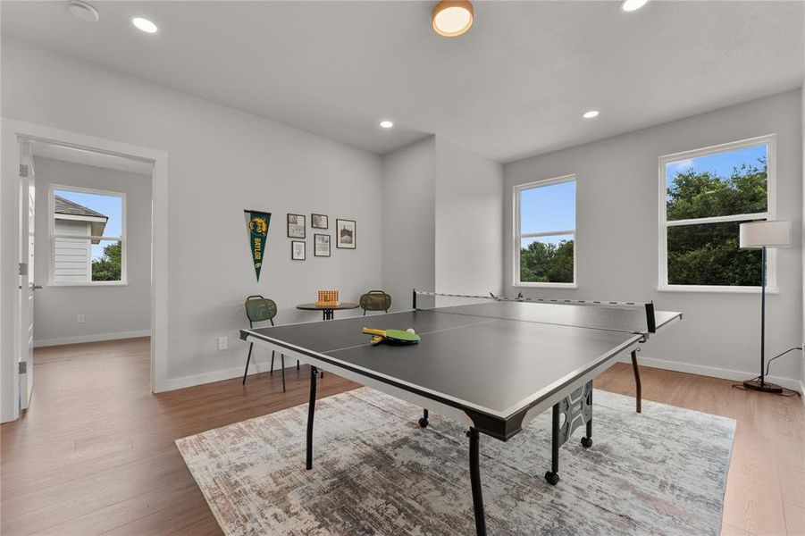 Game room featuring recessed lighting and light wood finished floors Game room featuring recessed lighting and light wood finished floors