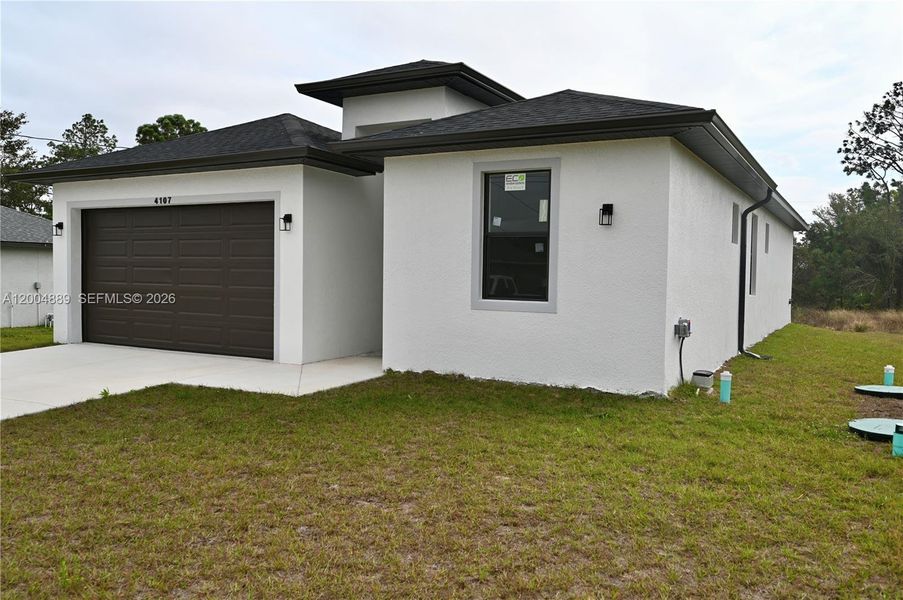 Front exterior of a new home in , Lehigh Acres, FL, highlighting curb appeal (Image 21).