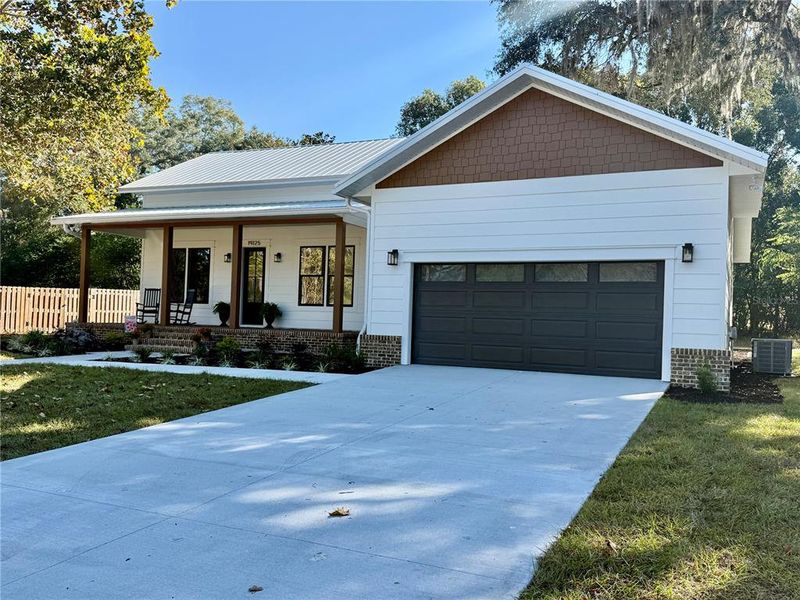 Front exterior of a new home in , High Springs, FL, highlighting curb appeal (Image 1).