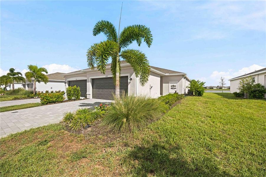 Front exterior of a new home in , Englewood, FL, highlighting curb appeal (Image 2). Front exterior of a new home in , Englewood, FL, highlighting curb appeal (Image 2).