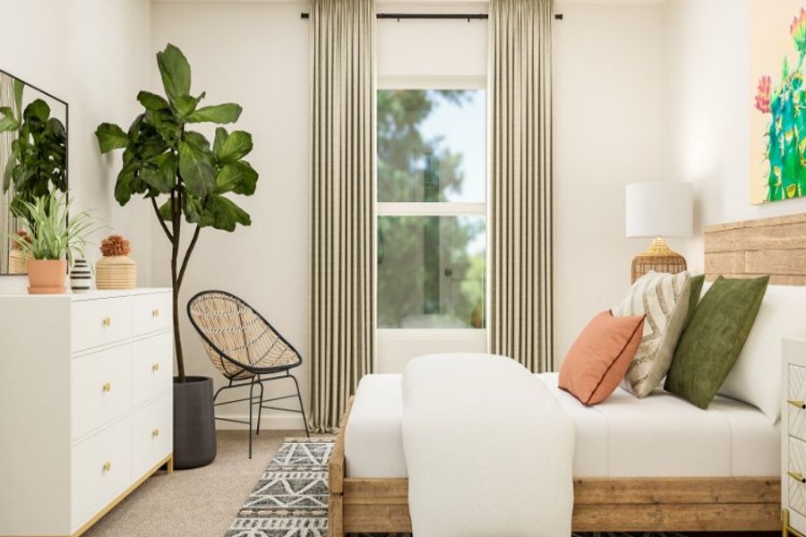 A living room with a white couch and a window.