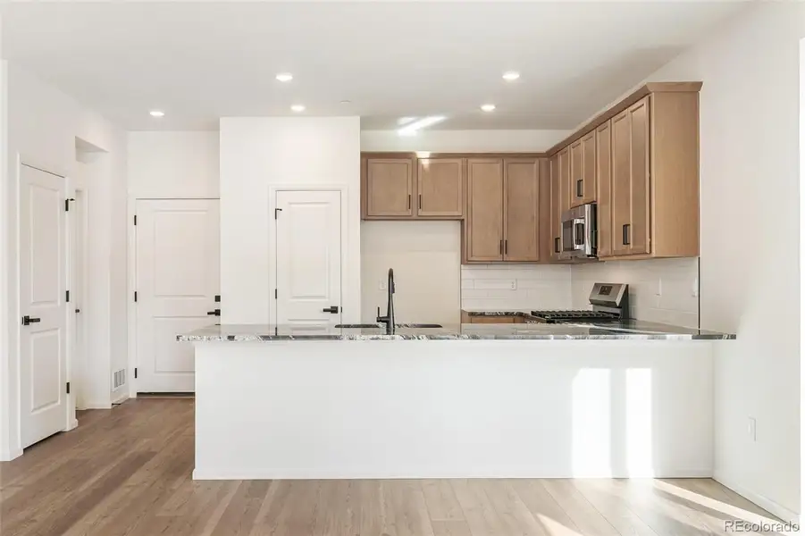 Furnished interior view inside a new home in Turnberry Villas, Commerce City (Image 16).