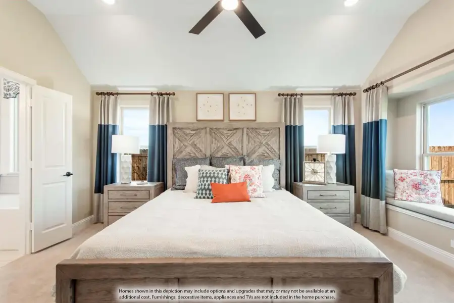 Master bedroom with vaulted ceiling, ceiling fan, wood headboard, and blue curtains with window seat