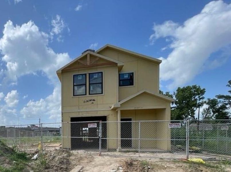 7101 Weyburn:  Discover the promise of a bright future in this stunning two-story home, perfectly positioned to bask in sunlight from the south. Located in the thriving community of Trinity Gardens and Settegast, this under-construction residence boasts a striking white exterior with sophisticated dark blue-green accents. Enveloped by a newly built wooden fence, this property offers both charm and privacy, making it an ideal opportunity for those seeking a vibrant and welcoming place to call home.