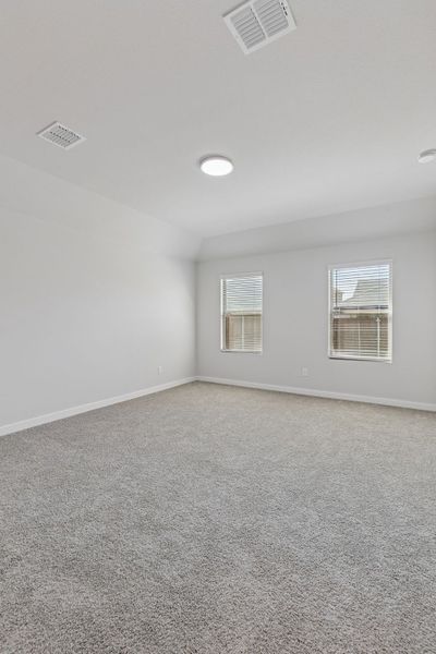 Bedroom in the Harrison home plan by Trophy Signature Homes – REPRESENTATIVE PHOTO
