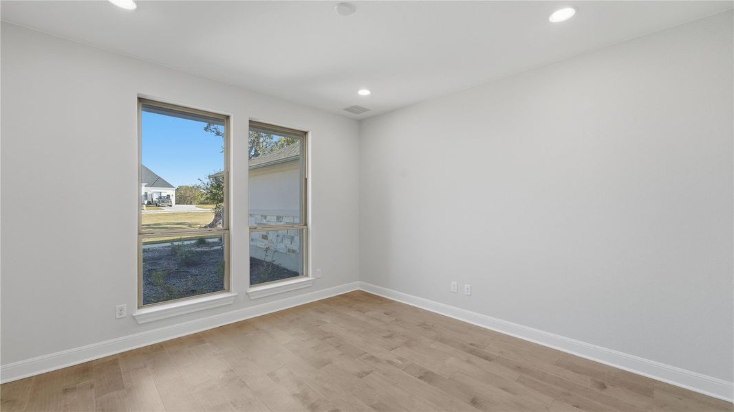 Spare room featuring light wood-style floors and recessed lighting Spare room featuring light wood-style floors and recessed lighting