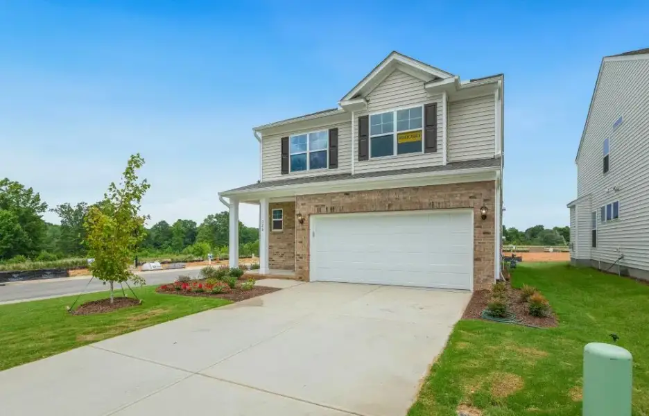 Representative exterior photo of a completed home built from the Ellerbe by Eastwood Homes in The Grove at Bratton Park, York, SC (Image 2).