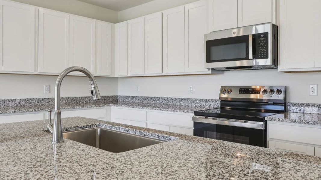 Kitchen of the Baker Floor Plan by DRB Homes in Liberty Trace New Homes in Haines City