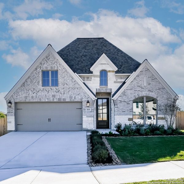 Front exterior of a new home in Cibolo Valley Heights 65', Cibolo, TX, highlighting curb appeal (Image 2).