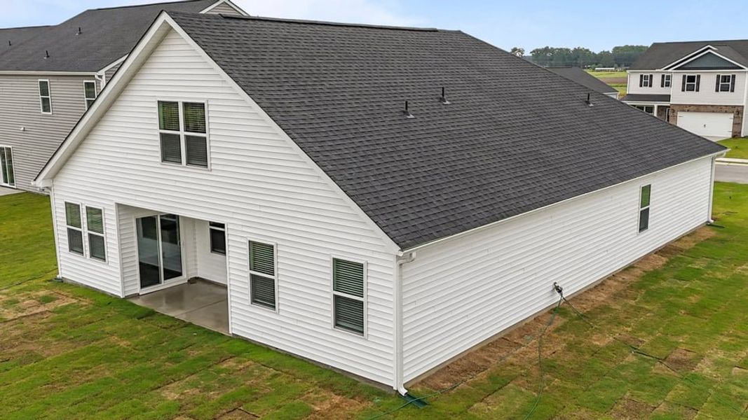 Exterior details and patio area of a home in East Ridge, Ayden (Image 18).