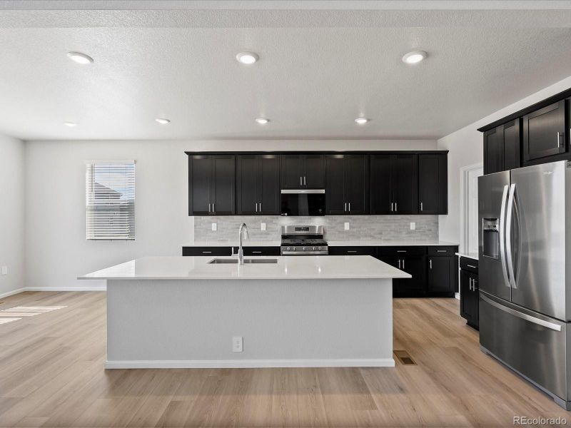 Furnished interior view inside a new home in Poudre Heights: The Alpine Collection, Windsor (Image 9).