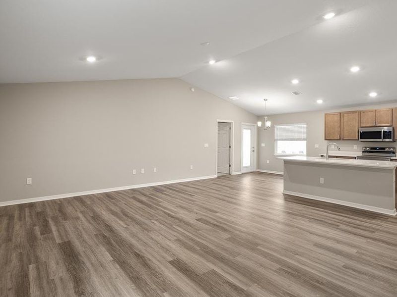 Enjoy a spacious and open living area - Begonia by Highland Homes