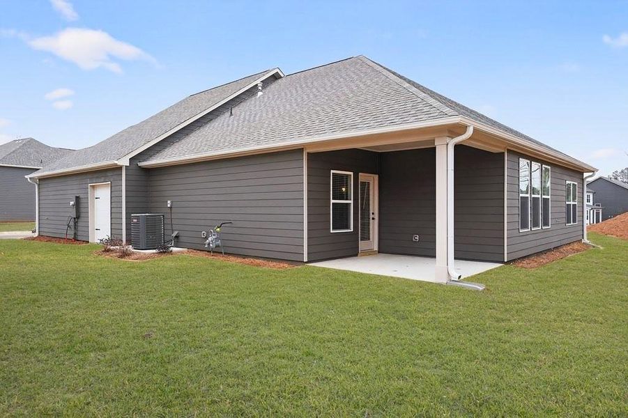 Exterior details and patio area of a home in The Fairways at Mirror Lake, Villa Rica (Image 29).