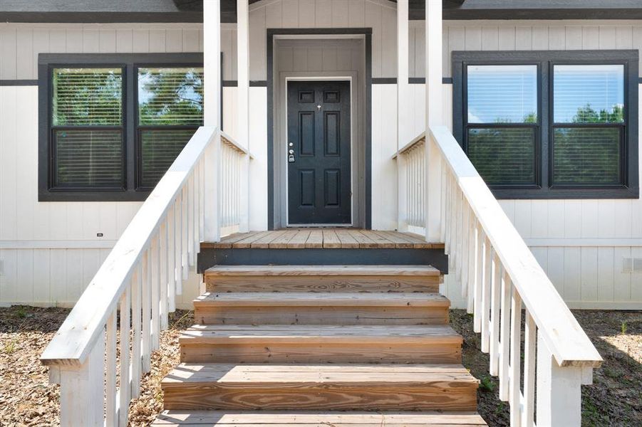 Front exterior of a new home in , Gilmer, TX, highlighting curb appeal (Image 2). Front exterior of a new home in , Gilmer, TX, highlighting curb appeal (Image 2).