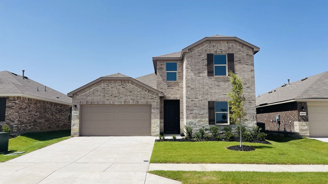Front exterior of a new home in Sunnycreek, Fort Worth, TX, highlighting curb appeal (Image 1). Front exterior of a new home in Sunnycreek, Fort Worth, TX, highlighting curb appeal (Image 1).