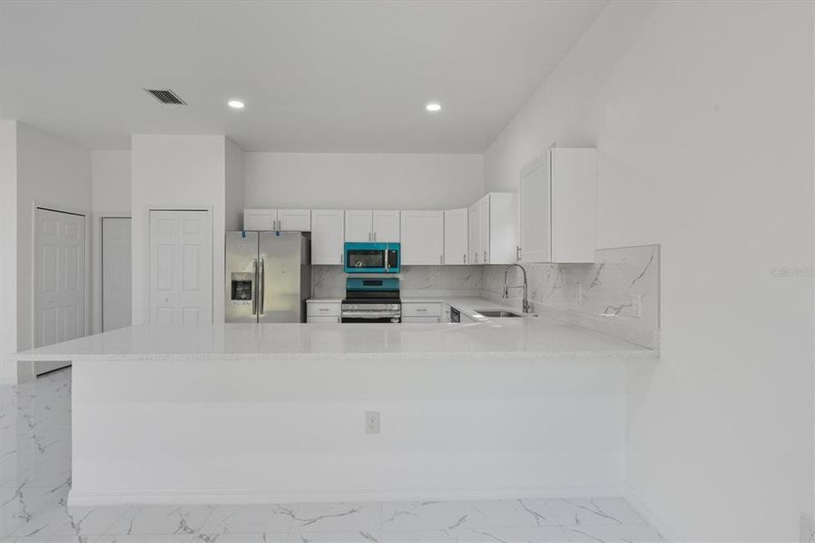 Furnished interior view inside a new home in , Punta Gorda (Image 12). Furnished interior view inside a new home in , Punta Gorda (Image 12).