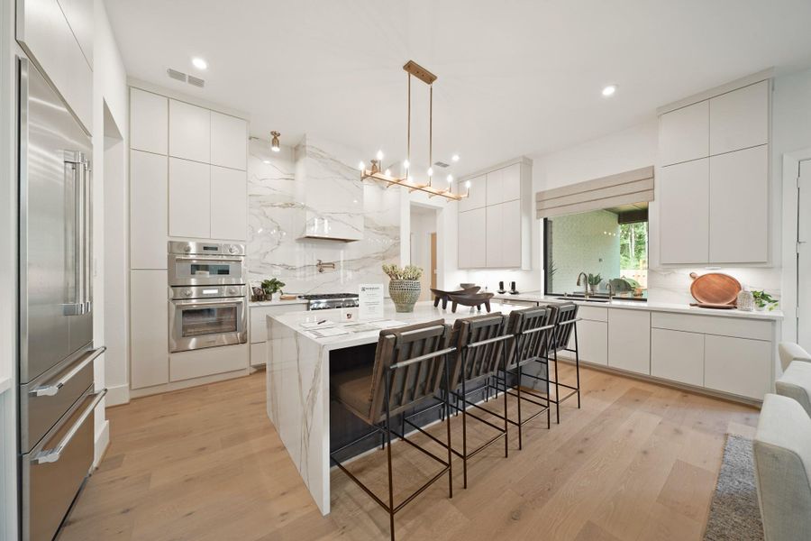 The pristine kitchen with a sink which overlooks the covered patio. Representational image.